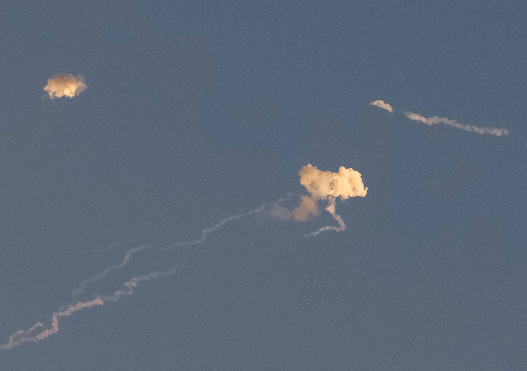 Missile traces and smoke after explosions of missiles are seen in the sky over the city during a Russian missile strike in Kyiv