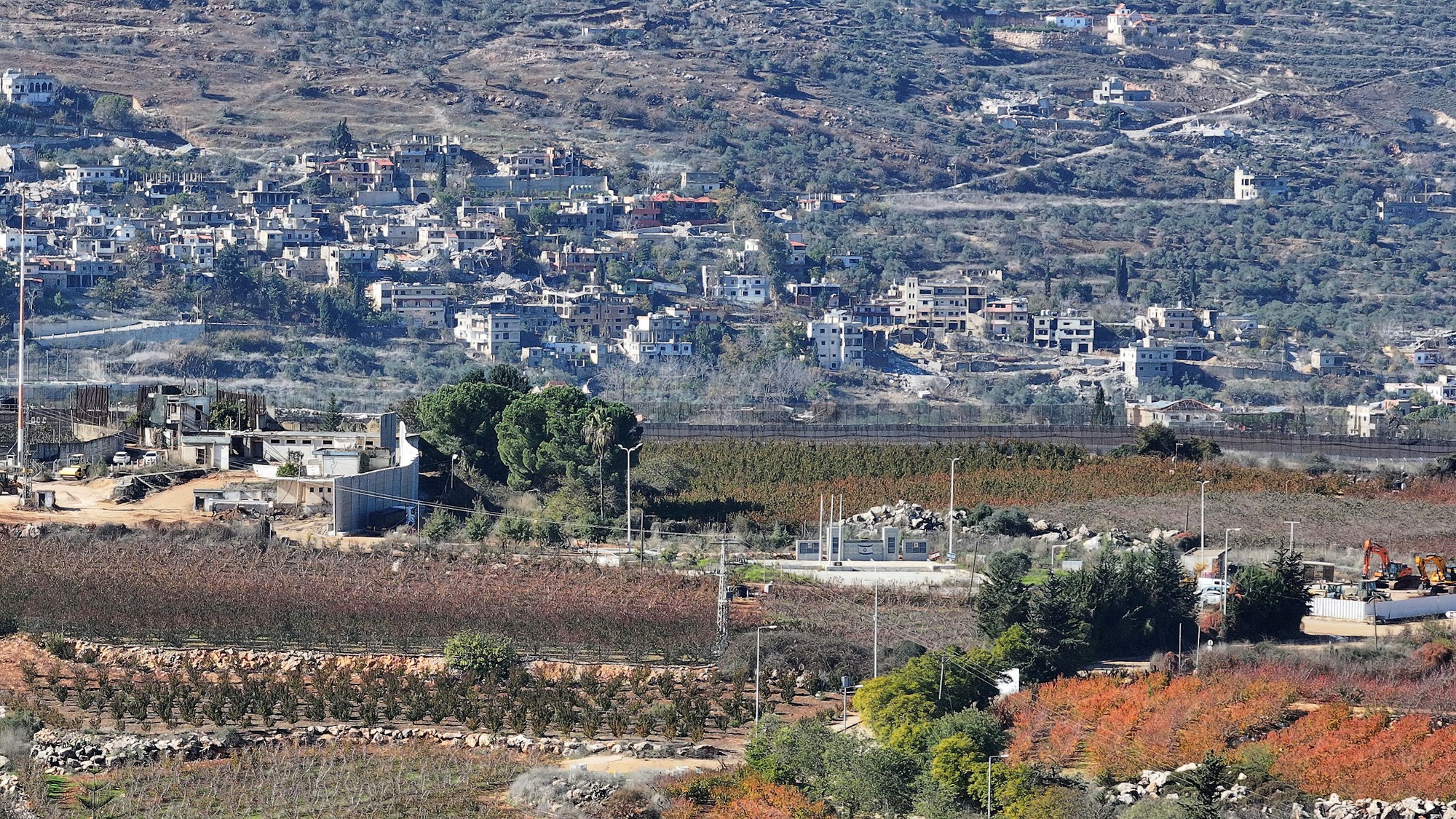 Buildings lie in ruin in Lebanon, as seen from Metula in northern Israel