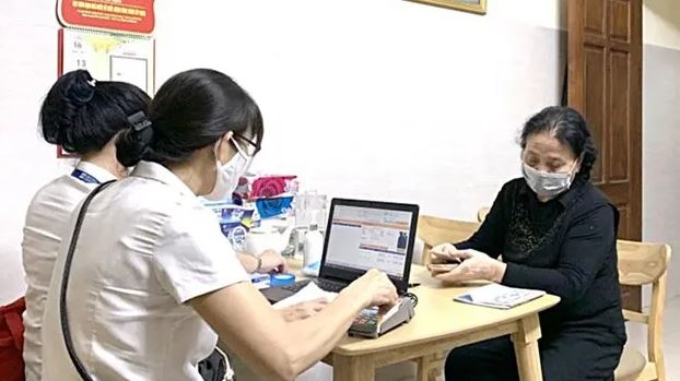 Thí điểm chi trả an sinh xã hội trên địa bàn thành phố Hà Nội - Ảnh 1.