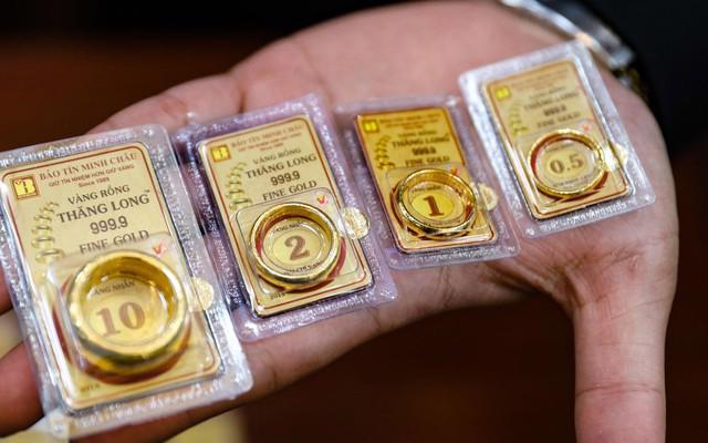 Vàng và USD hạ nhiệt sau loạt biện pháp điều hành- Ảnh 1.