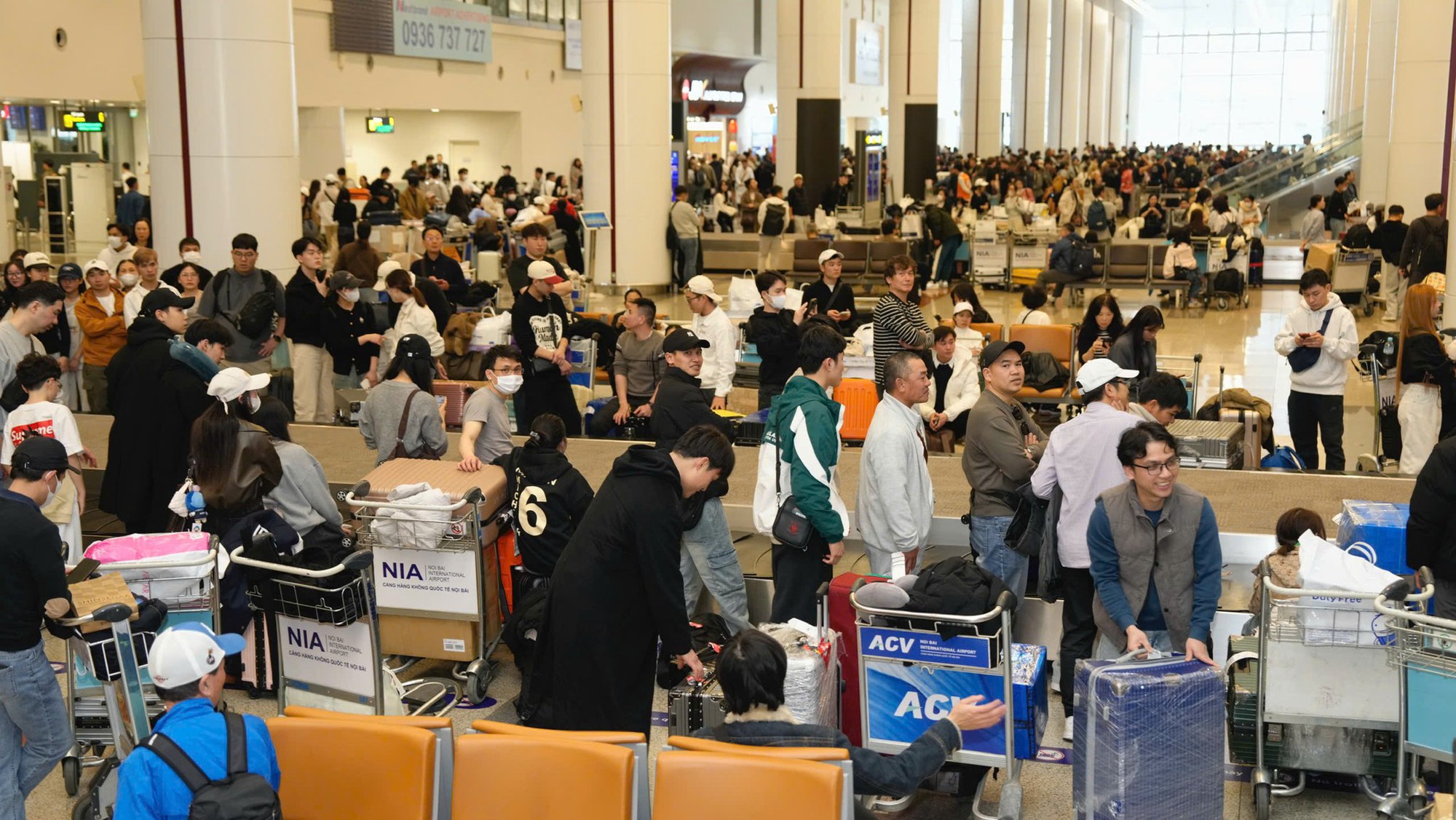Nội Bài lập kỷ lục hơn 124.000 khách ngày cuối kỳ nghỉ Tết - Ảnh 4.