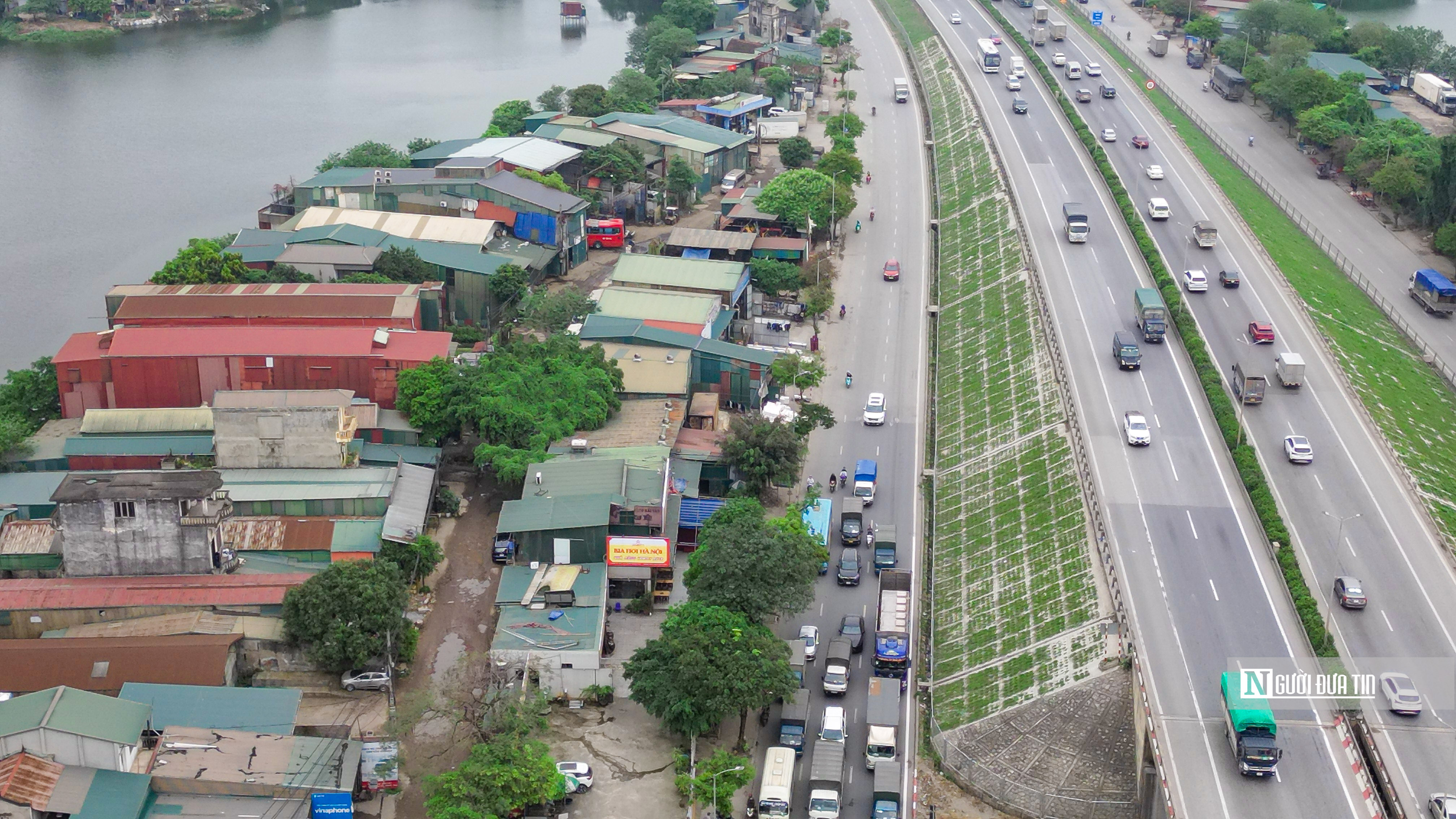 Môi trường - Hà Nội: Đổ phế thải lấp ao hồ tại phường Yên Sở (Hình 2).