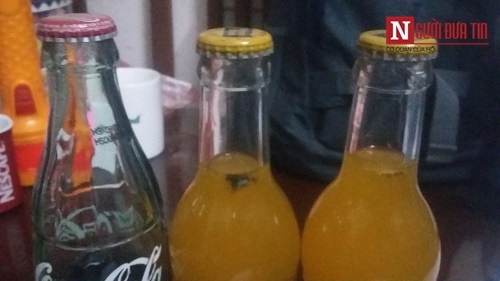 Pháp luật - Vật thể lạ nổi lập lờ trong chai nước cam của Coca Cola Việt Nam (Hình 3).