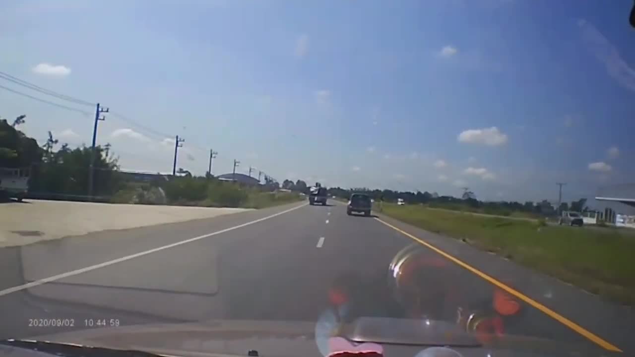 Flying Metal Smashes Car Windscreen