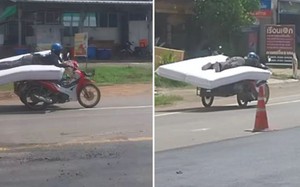 Thót tim cảnh người đàn ông lái xe máy trong khi nằm trên nệm