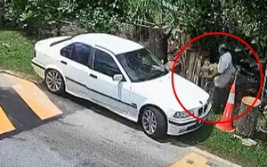 Tài xế đi BMW bị camera ghi lại hành động xấu xí trước nhà dân
