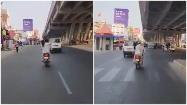 Ngồi sau xe máy, vợ bất ngờ rút dép đánh chồng tới tấp- Ảnh 1. Ngồi sau xe máy, vợ bất ngờ rút dép đánh chồng tới tấp- Ảnh 1.