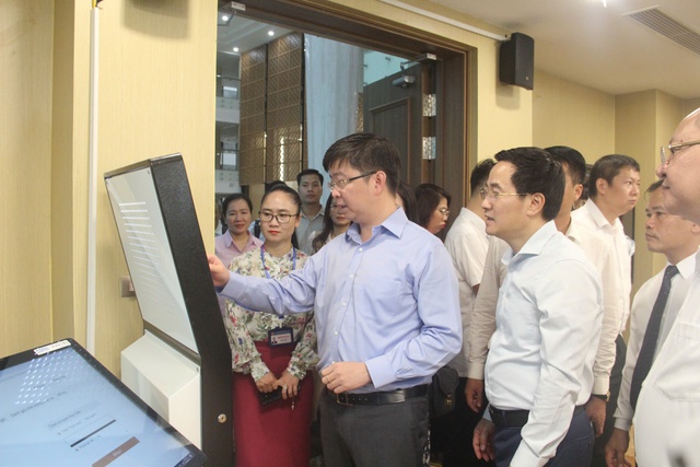 Hà Nội đề xuất triển khai mô hình “Trạm số hóa” tại bộ phận một cửa các cấp - Ảnh 2.