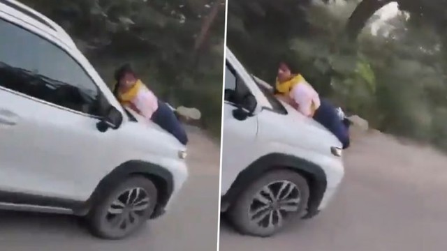 Vợ bám vào nắp capo xe ô tô sau khi bắt quả tang chồng ngoại tình - Ảnh 1.