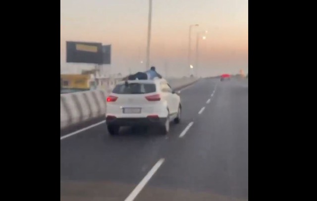 Cảnh sát bám trên nóc xe ô tô trong cuộc rượt đuổi kéo dài gần 40km - Ảnh 1.
