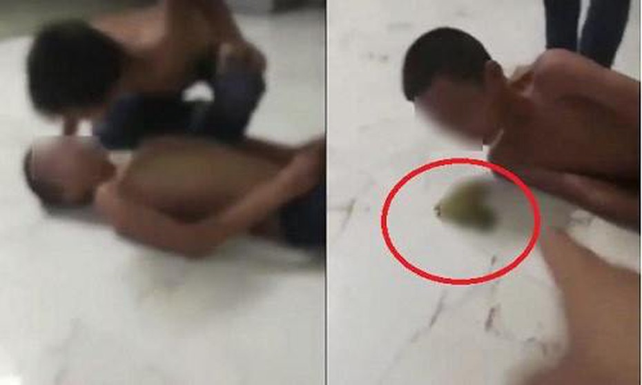 Người bố ép con nhổ nước bọt vào miệng nhau bất hợp tác với cơ quan chức năng