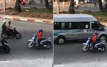 Người phụ nữ thản nhiên dừng xe nghe điện thoại giữa đường ngược chiều