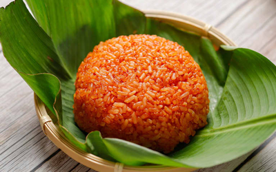 Mách bạn cách nấu xôi gấc cúng Tết để năm mới "đỏ như son"