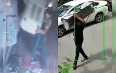 Người đàn ông trộm cây nước rồi đi bộ trên phố