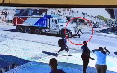 Bị xe tải cuốn vào gầm, cô gái sống sót khó tin