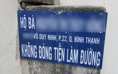 Ai treo biển bêu tên nữ chủ hộ vì "không đóng tiền làm đường"?